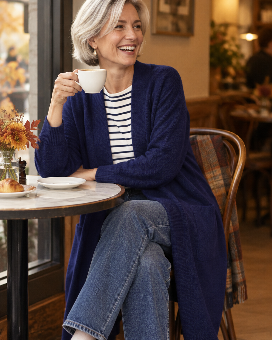 Longline cardigan in navy blue over a striped top