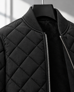 Close-up of the ribbed collar, zip and diamond quilting